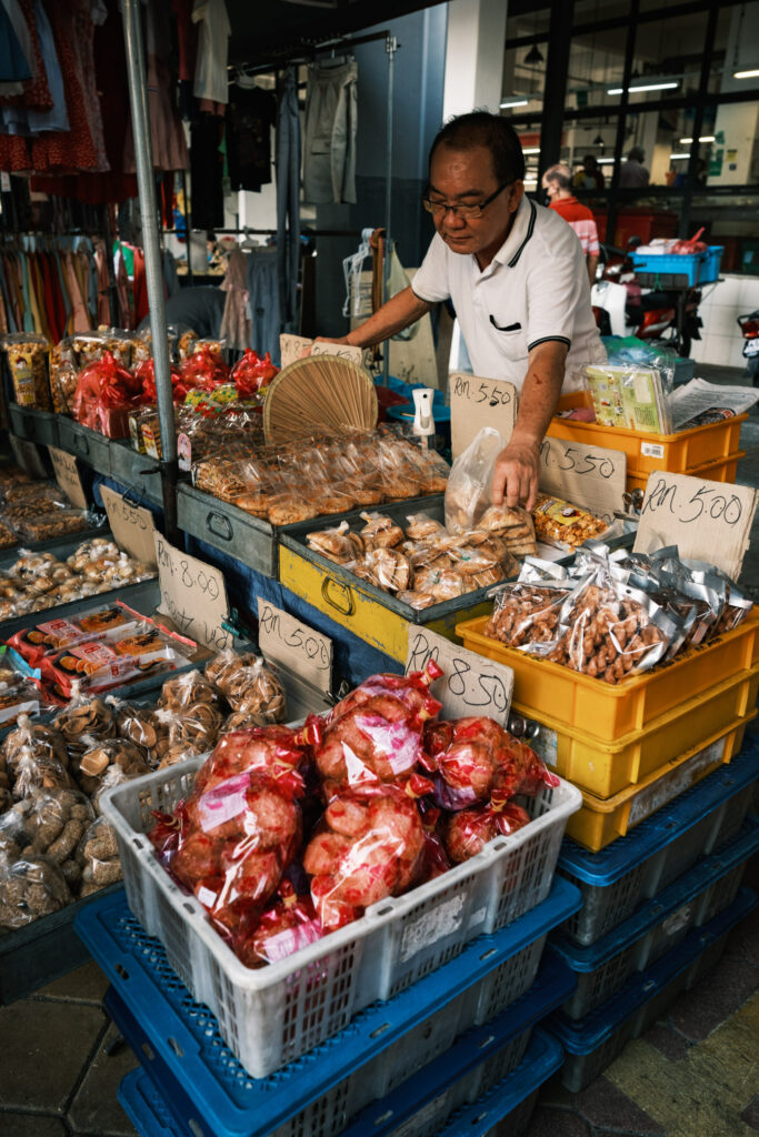 Stall selling local snacks at Chowrastra Street, George Town, Penang, Malaysia.